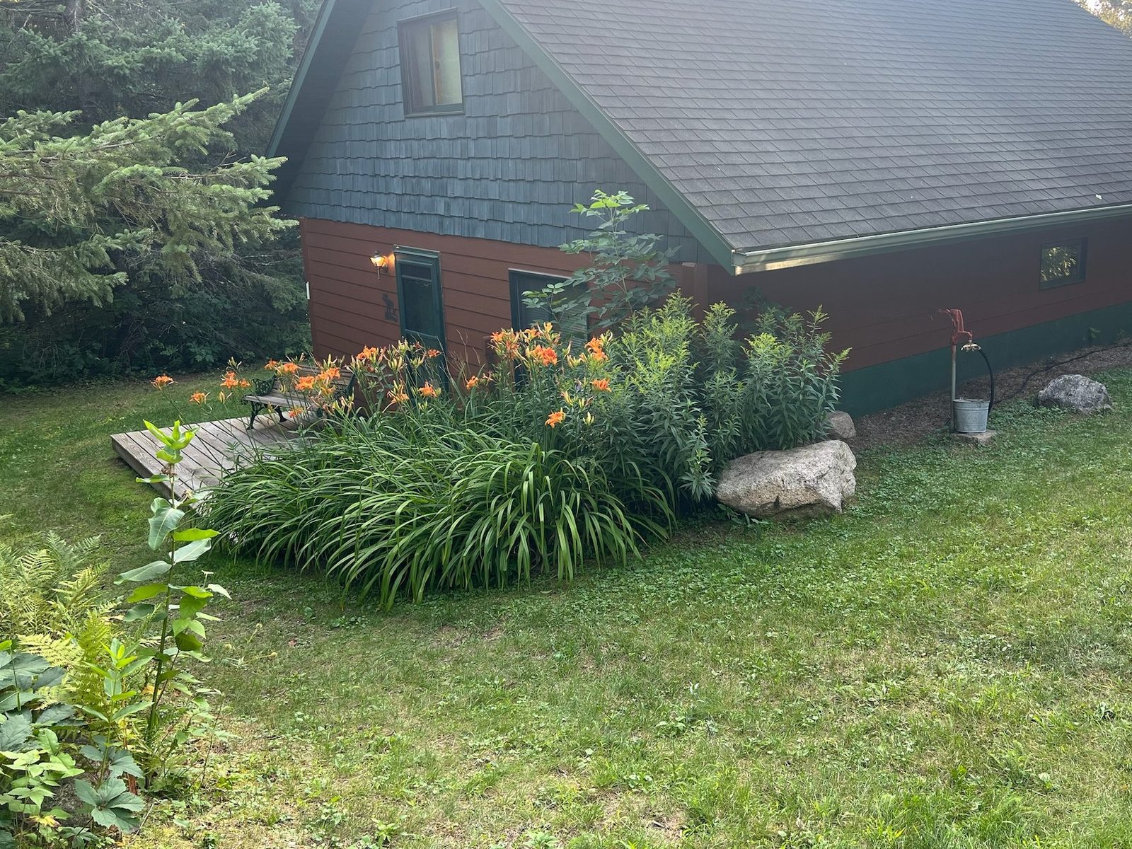 Front entry of the cabin with summer lilies
