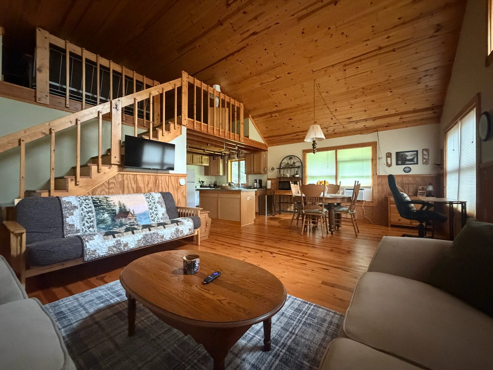 Great room with pine ceilings, open to the loft and kitchen